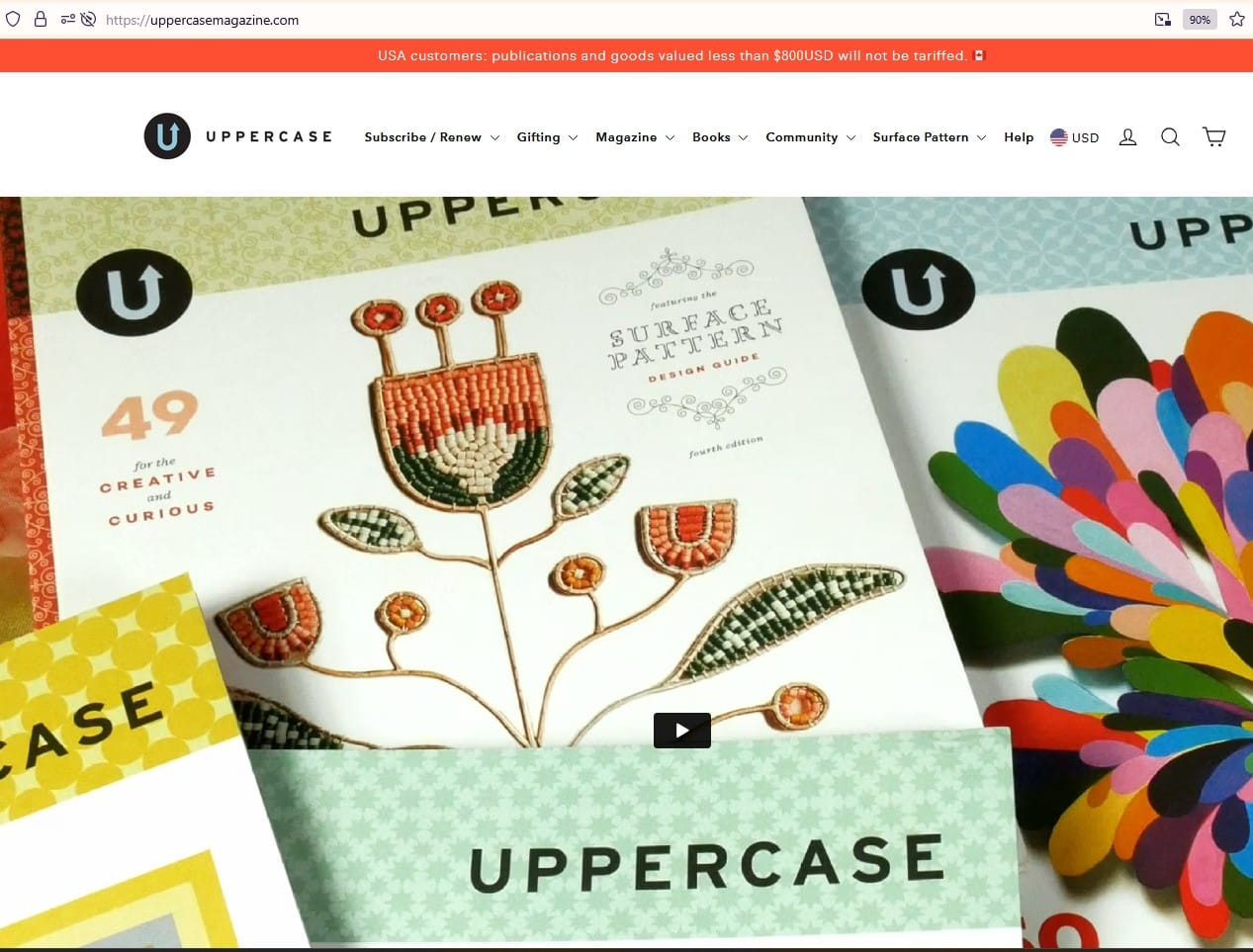 Screenshot of the Uppercase Magazine home page feat. a photo of several magazines on top of each other